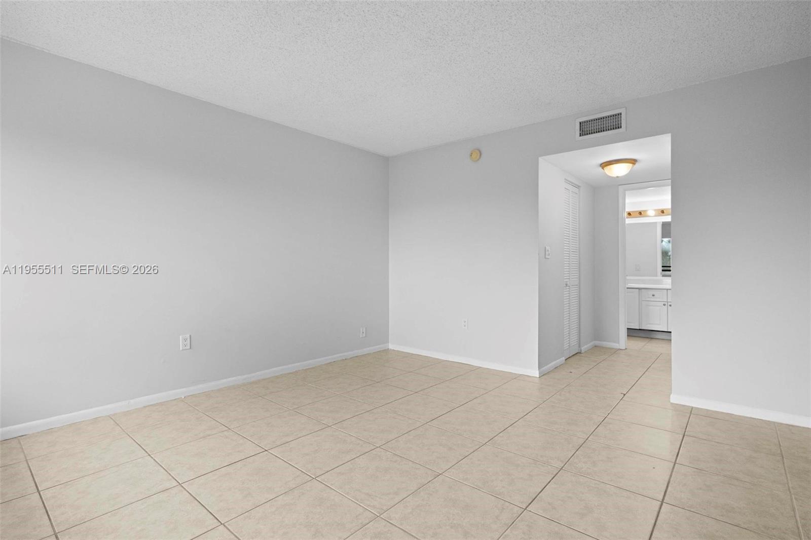 711 North Pine Island Road, Unit 410 Plantation, FL 33324 - Photo 9 of 45 a view of an empty room and wooden floor