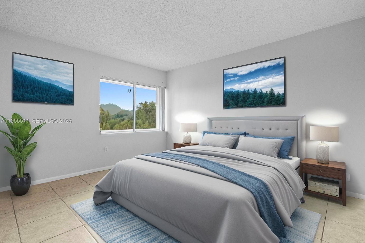 711 North Pine Island Road, Unit 410 Plantation, FL 33324 - Photo 10 of 45 a bedroom with a bed and a painting on the wall