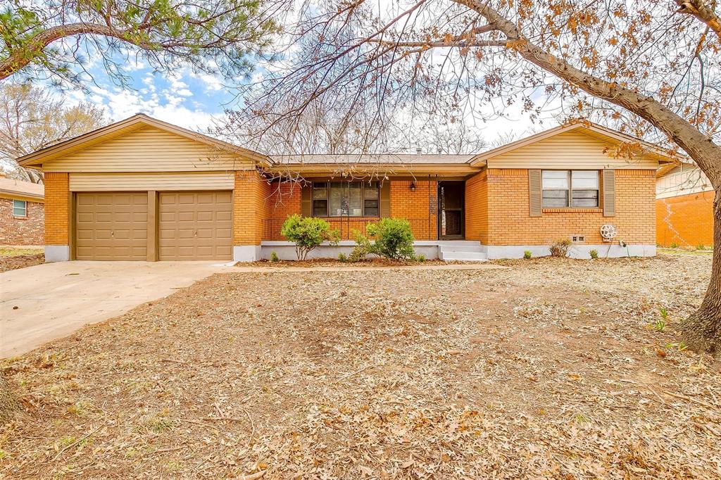 1212 Crestview Drive Hurst, TX 76053 - Photo 1 of 1 a front view of a house with a yard and garage