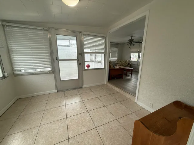 a view of room with window and wooden floor