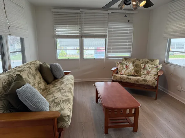 a living room with furniture and a window
