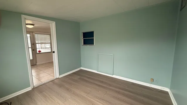 a bathroom with a granite countertop toilet and a sink
