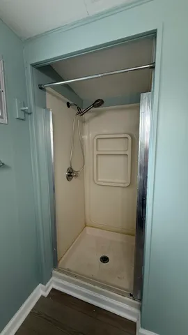 a view of a room that has a bed in it