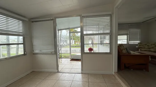 a bathroom with a tub and glass door