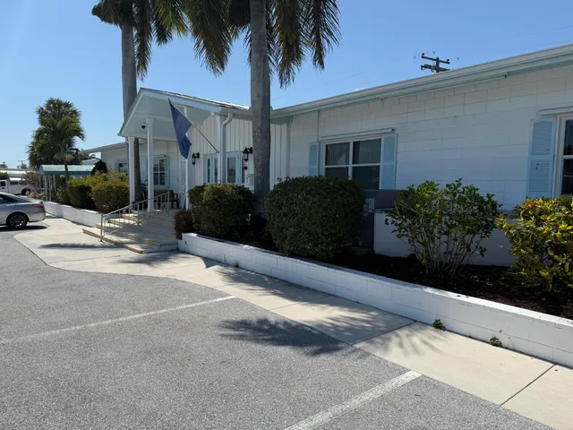 a view of a patio with a table and chairs