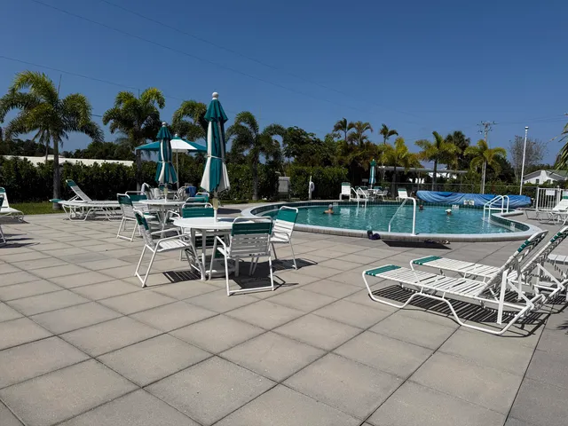 a view of a lounge chairs with a patio