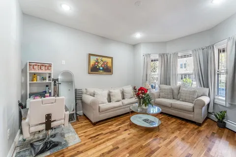 a living room with furniture and a table