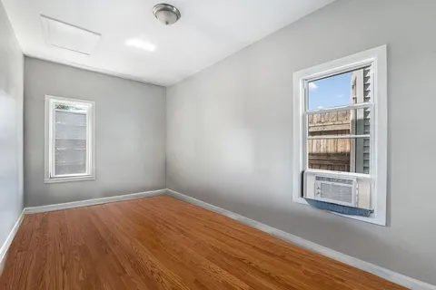 a bedroom with a bed and a chair