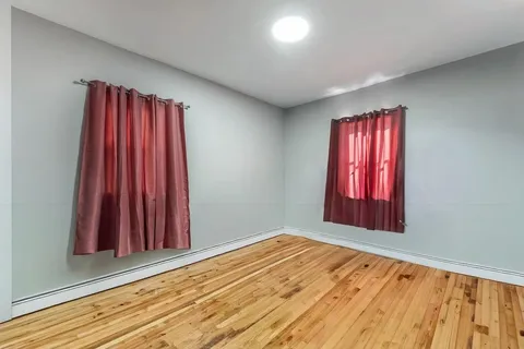 a view of a room with window and a bathroom