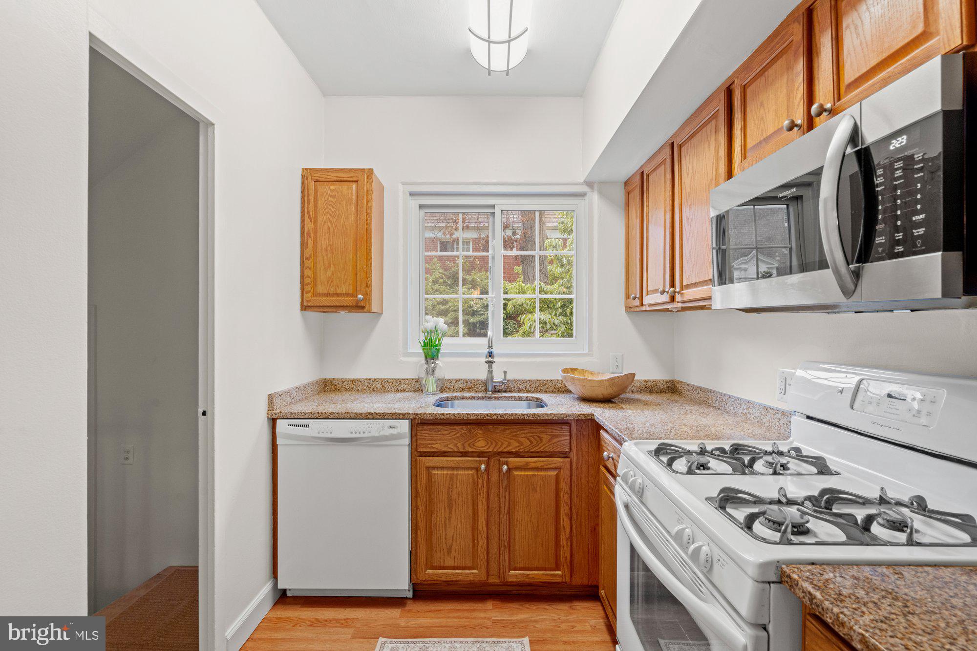 3304 Gunston Road Alexandria, VA 22302 - Photo 10 of 28 a kitchen with a stove and a sink