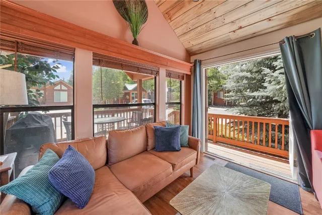 a balcony with furniture and a potted plant