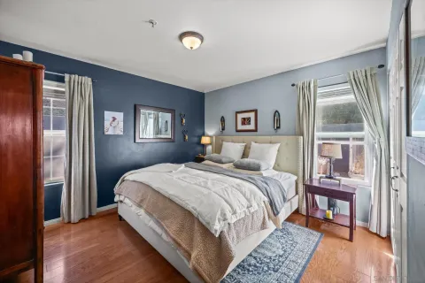 a bed room with a bed and a painting