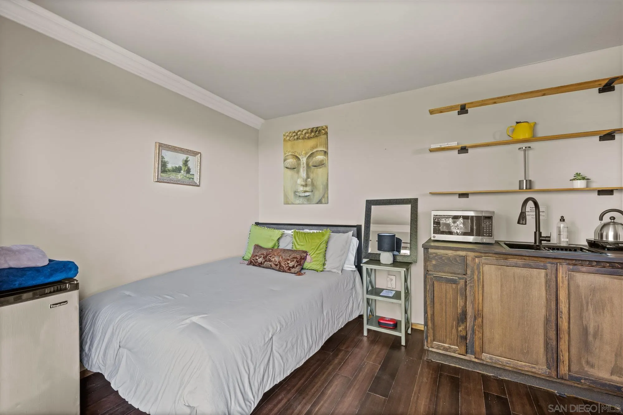 5058 Acorn Patch Road Julian, CA 92036 - Photo 23 of 32 a bedroom with a bed and cabinets