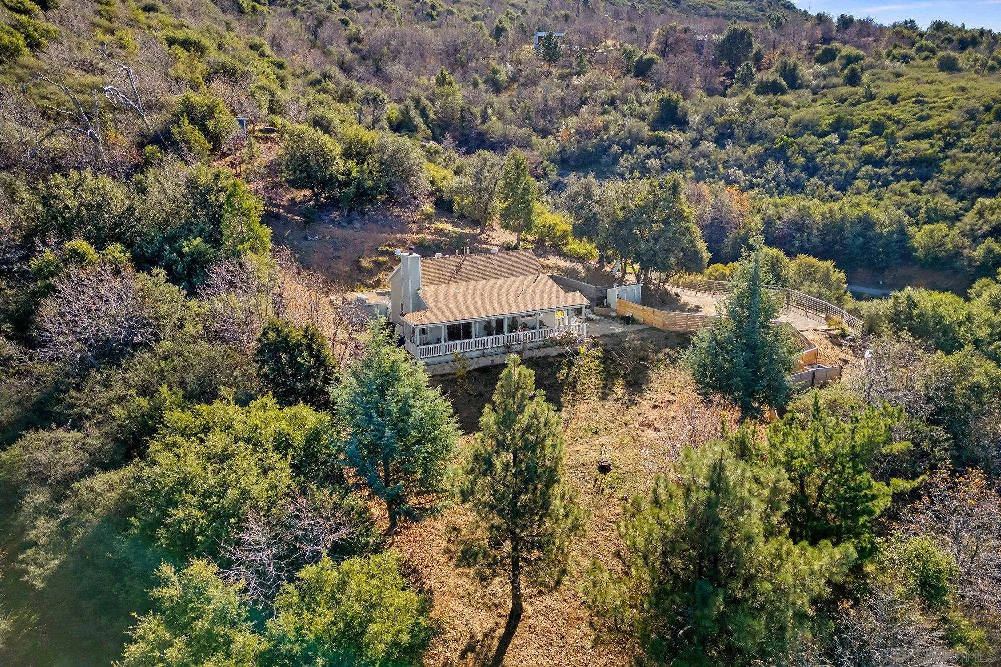 5058 Acorn Patch Road Julian, CA 92036 - Photo 26 of 32 an aerial view of a house with a yard and lake view