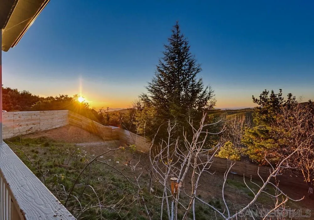5058 Acorn Patch Road Julian, CA 92036 - Photo 30 of 32 a view of a backyard of a house with a yard