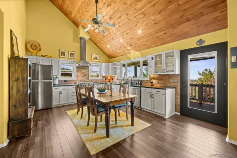 a open kitchen with a table and chairs