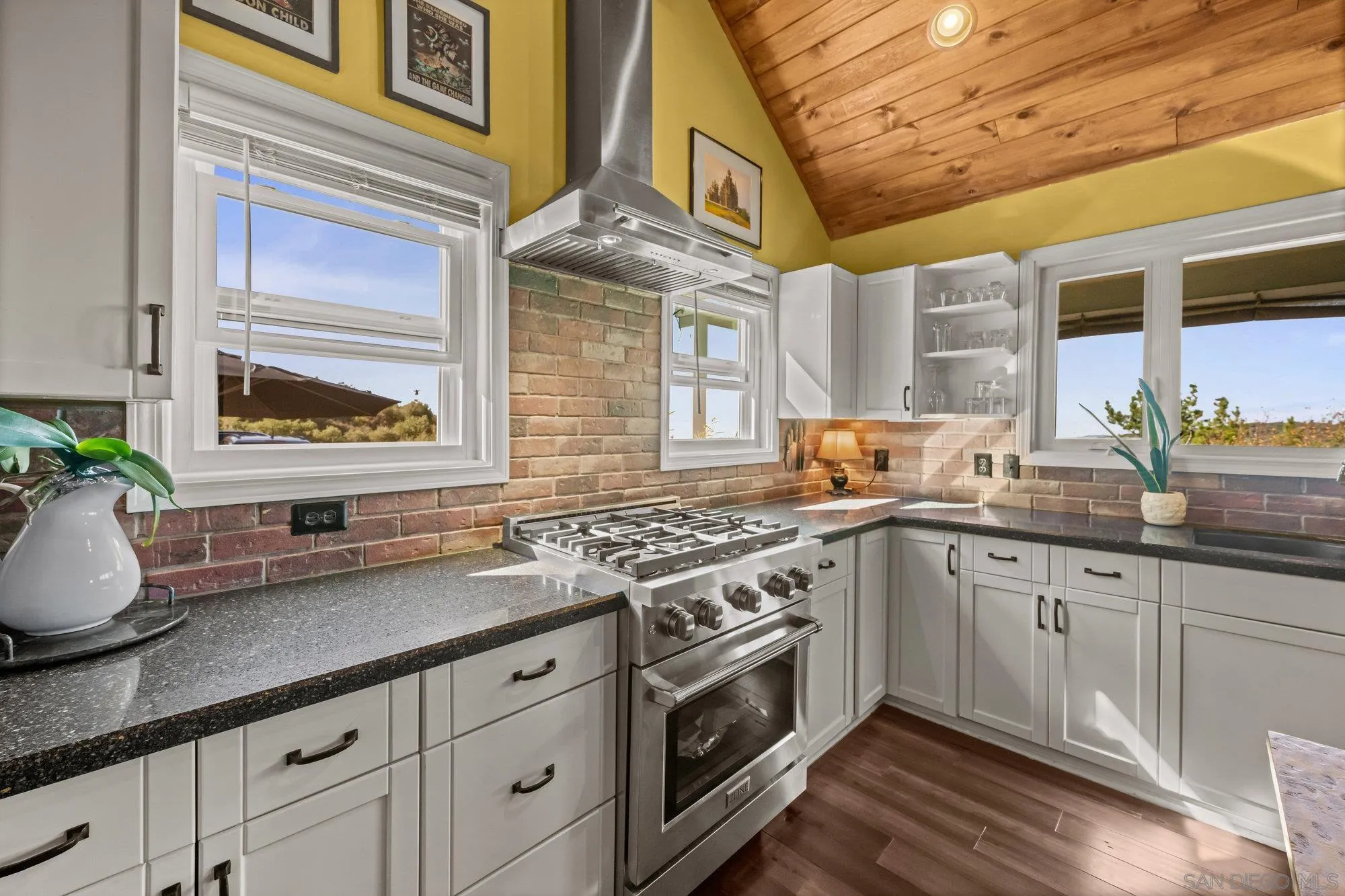5058 Acorn Patch Road Julian, CA 92036 - Photo 10 of 32 a kitchen with stainless steel appliances granite countertop a sink a stove and cabinets