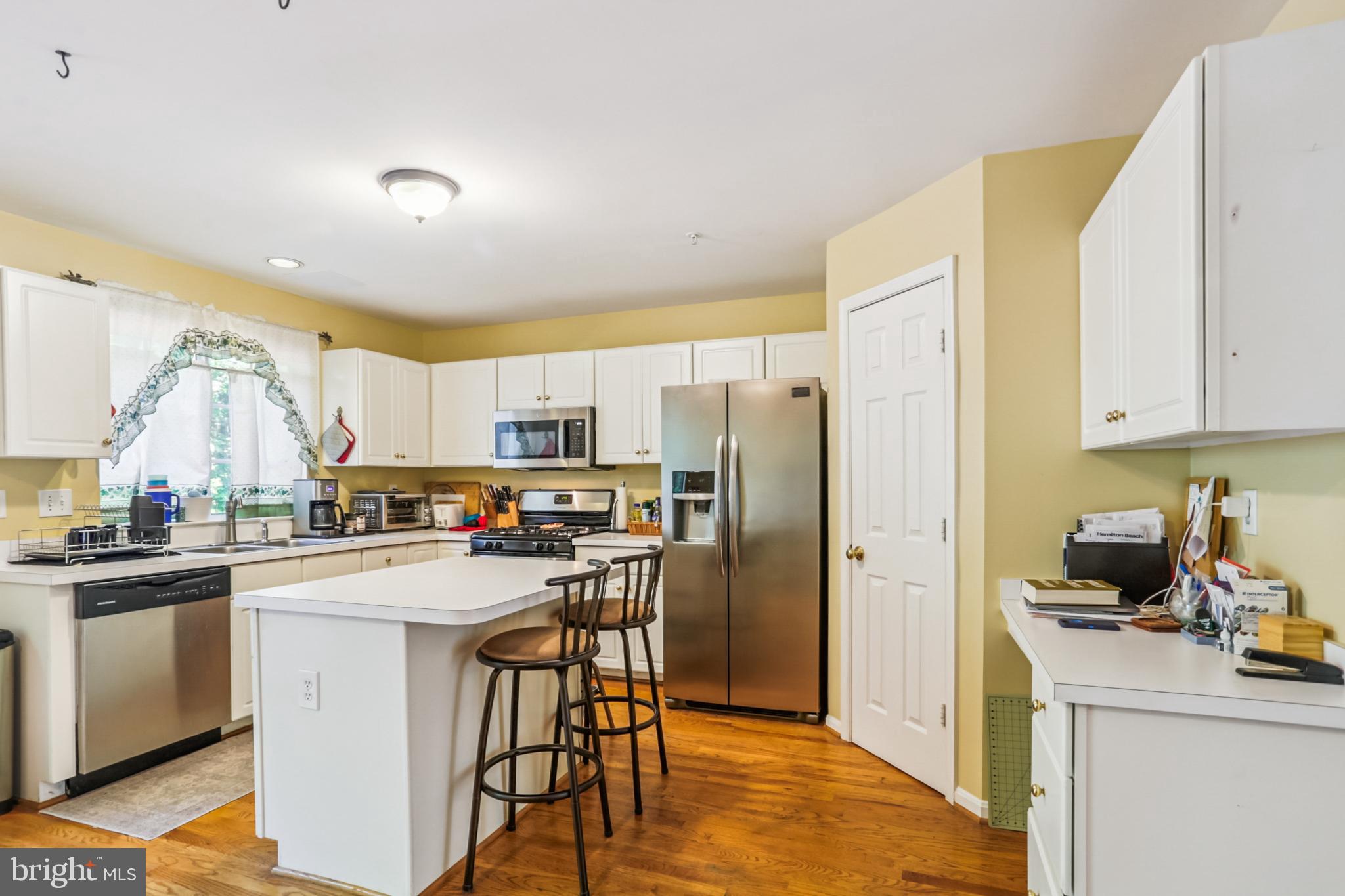 15129 Deer Valley Terrace Silver Spring, MD 20906 - Photo 5 of 30 Bright and inviting kitchen w/ island & seating.