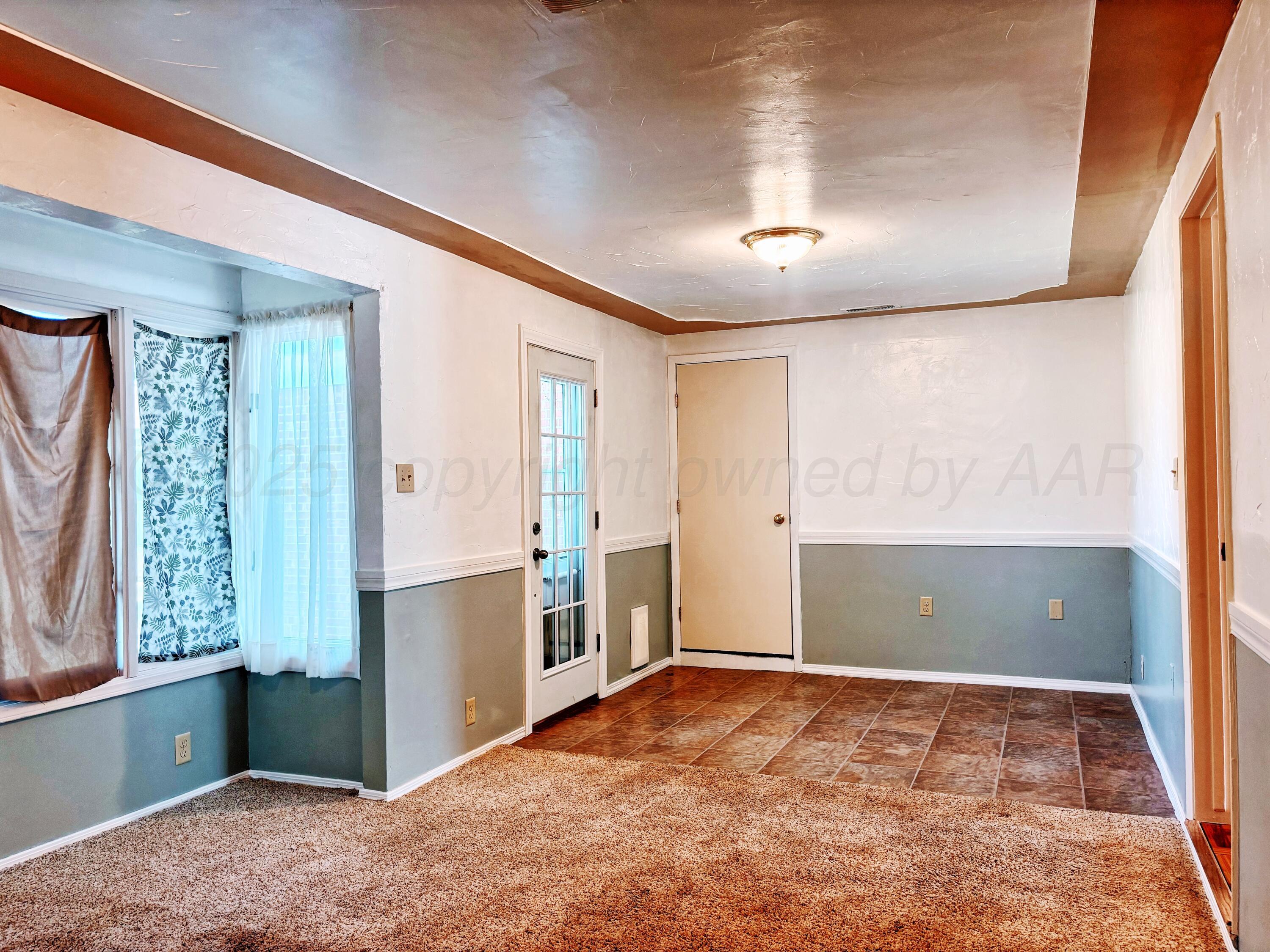 1510 South Indiana Street Perryton, TX 79070 - Photo 29 of 39 a view of an empty room with a window