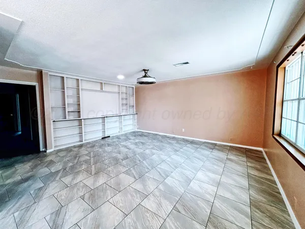 a view of empty room with windows