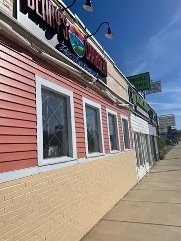 a view of a house with a small yard