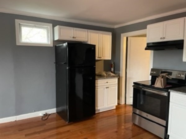 377 Park Avenue Worcester, MA 01610 - Photo 9 of 14 a kitchen with stainless steel appliances granite countertop a refrigerator and a stove