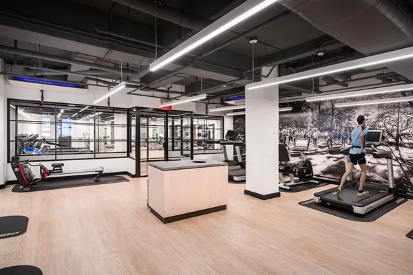 a view of gym room with gym equipment