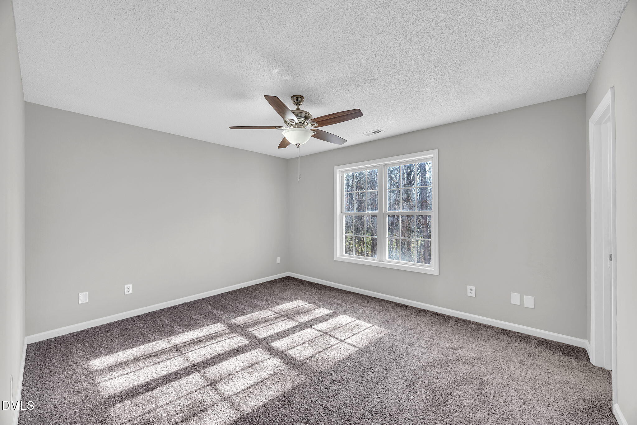 2231 Violet Bluff Court Raleigh, NC 27610 - Photo 11 of 16 a view of wooden floor and a chandelier fan in a room