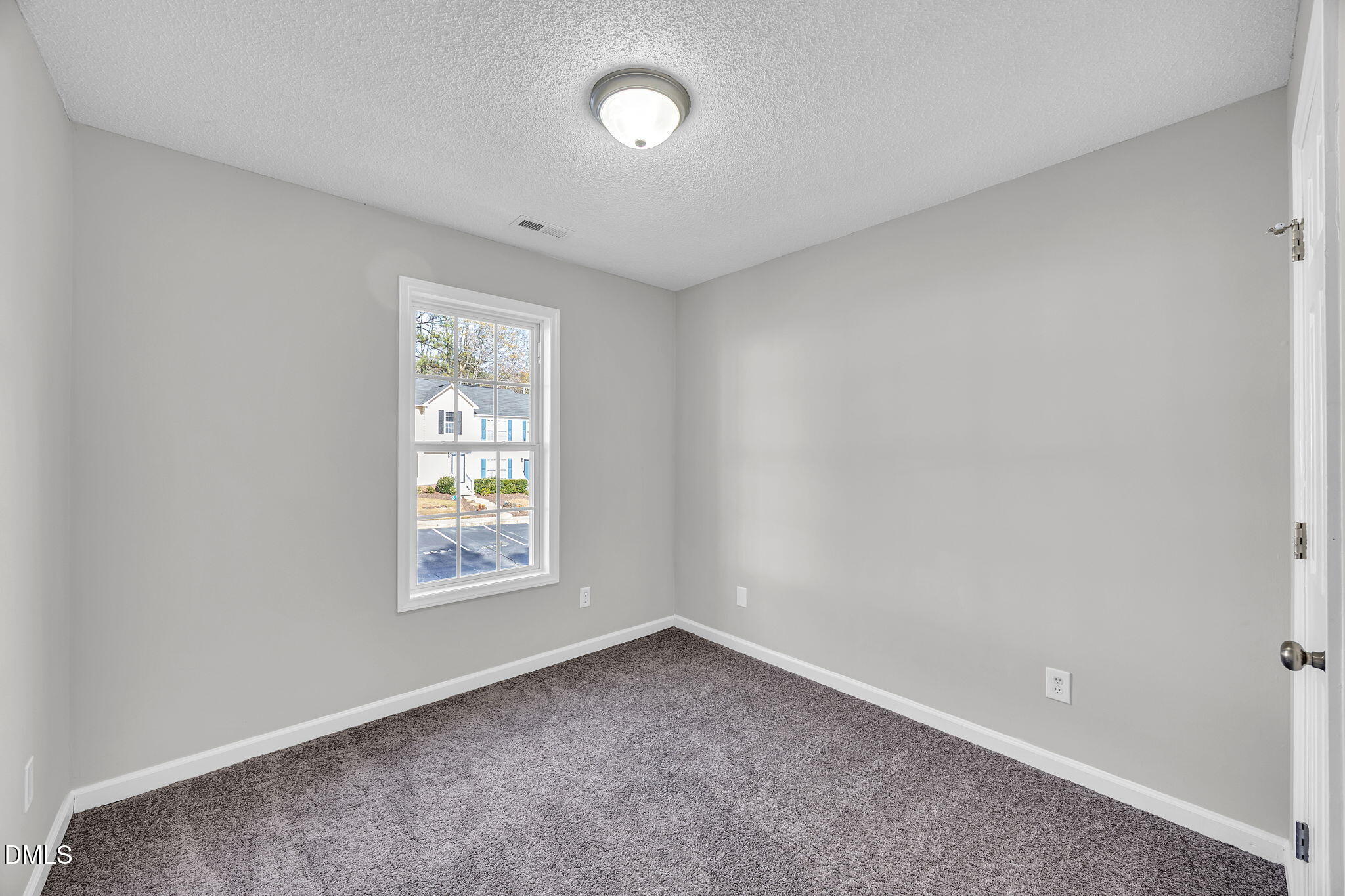2231 Violet Bluff Court Raleigh, NC 27610 - Photo 14 of 16 an empty room with a window