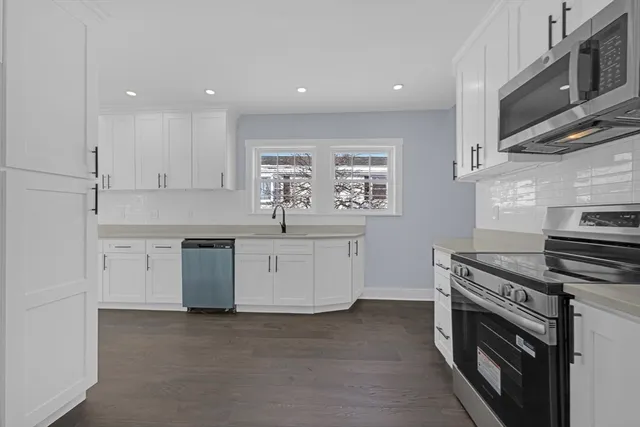 a kitchen with a stove and a microwave