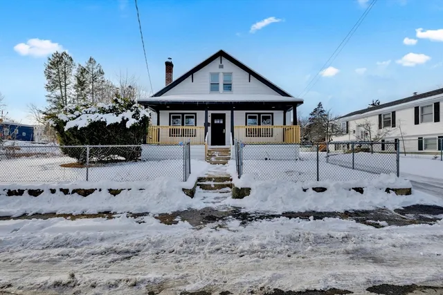 a front view of a house with yard