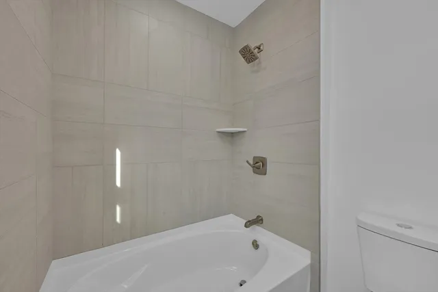 a bathroom with a white tub
