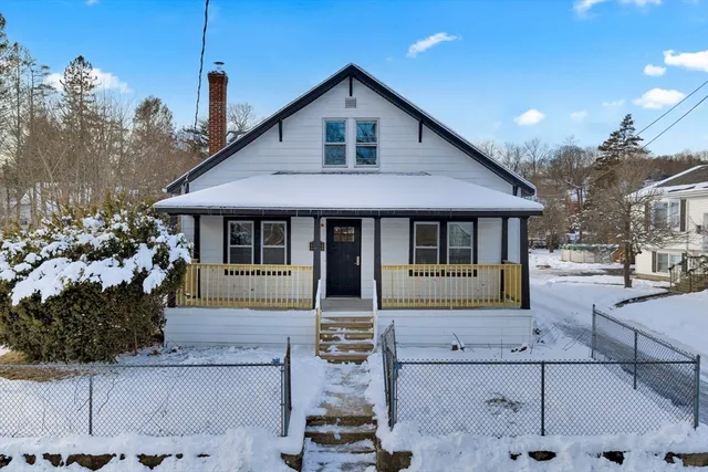a front view of a house with a porch