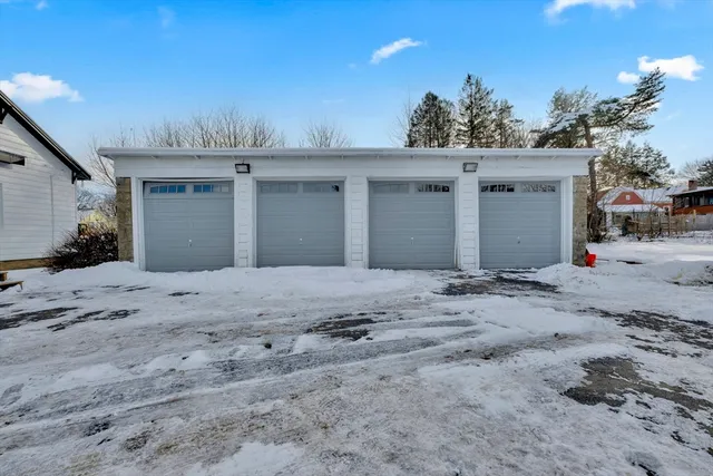 a view of a dry yard with potted plants