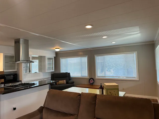 a living room with furniture and windows