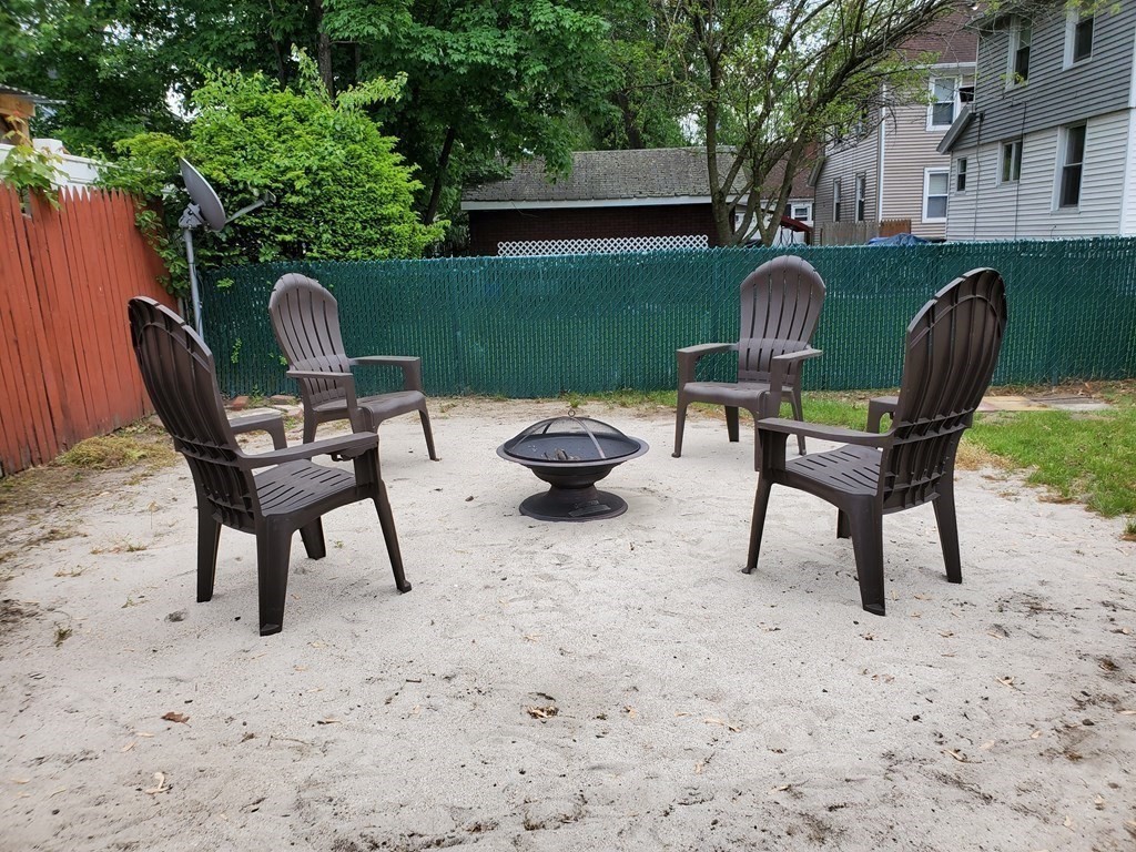 21 Nathaniel Street Springfield, MA 01109 - Photo 18 of 20 a view of a backyard with furniture and a grill