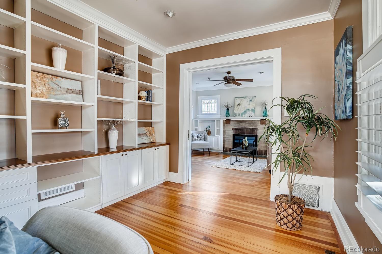 1028 Cook Street Denver, CO 80206 - Photo 18 of 40 a living room with furniture and a fireplace