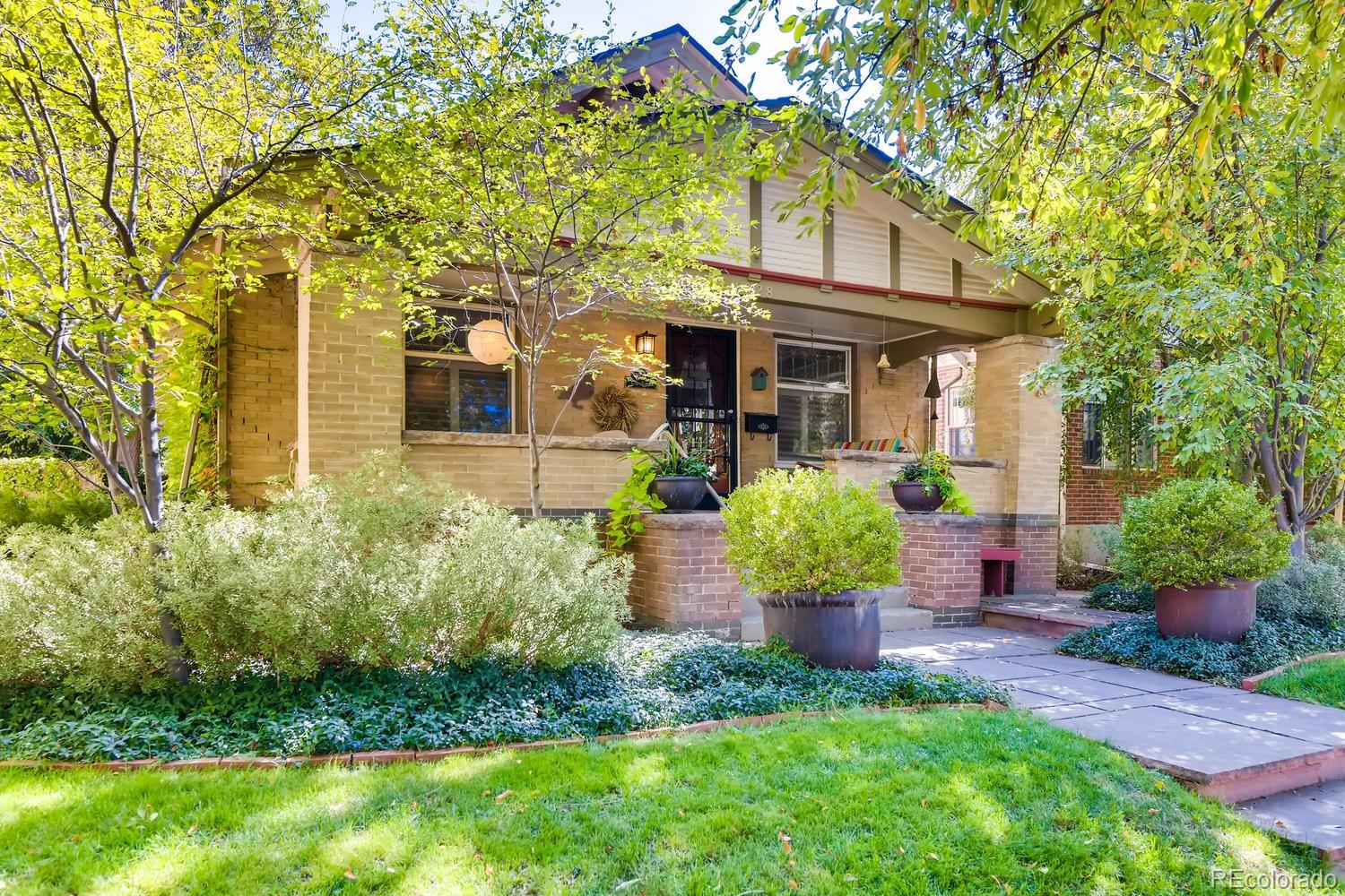 1028 Cook Street Denver, CO 80206 - Photo 2 of 40 a front view of a house with garden