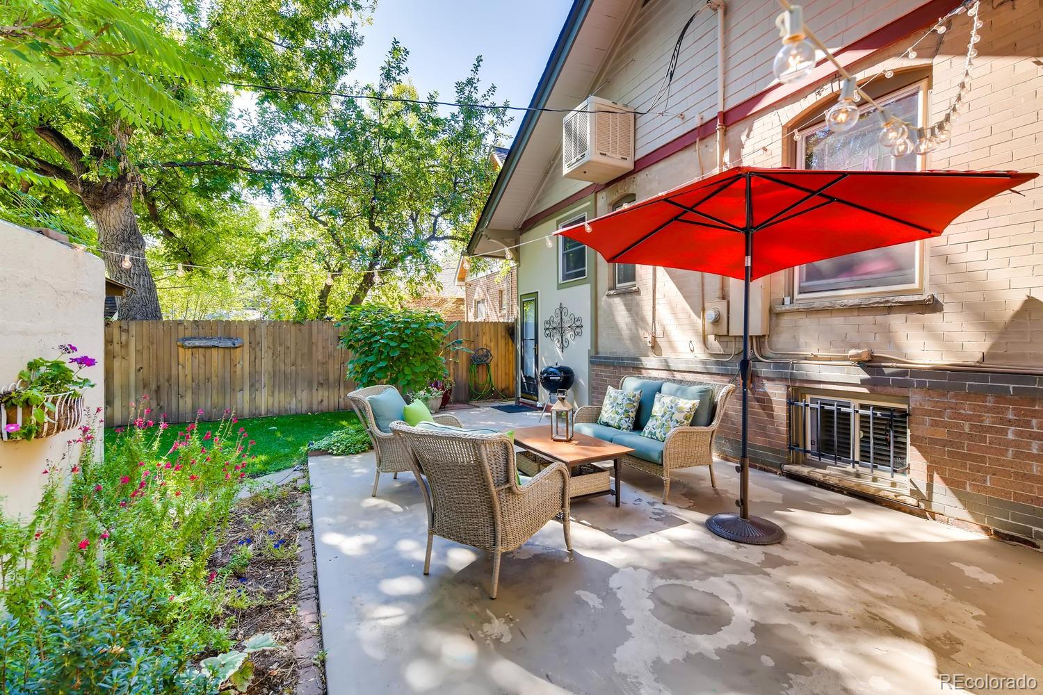 1028 Cook Street Denver, CO 80206 - Photo 30 of 40 a view of a backyard with sitting area