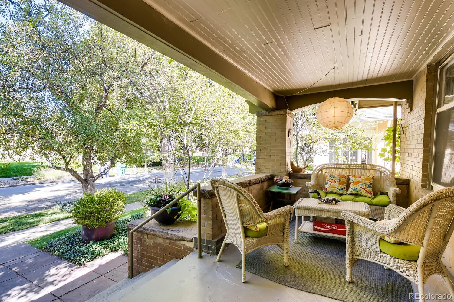 1028 Cook Street Denver, CO 80206 - Photo 3 of 40 a outdoor space with patio lots of furniture and garden view