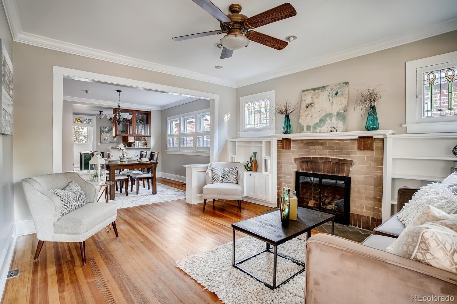 1028 Cook Street Denver, CO 80206 - Photo 5 of 40 a living room with furniture and a fireplace
