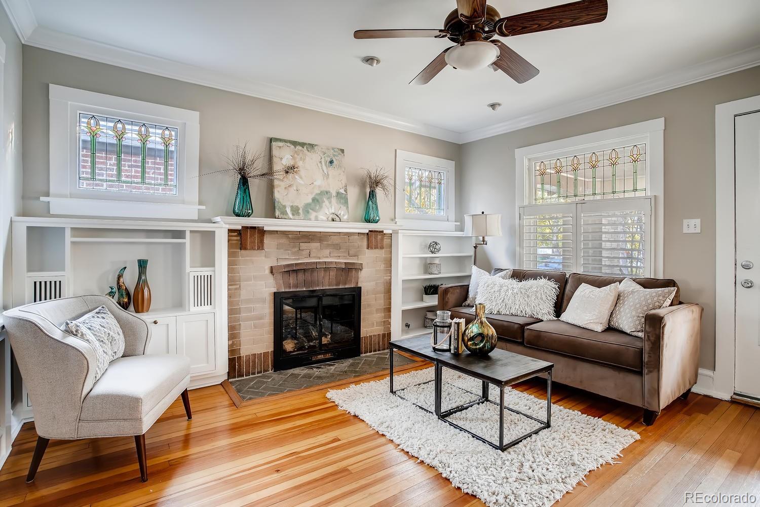 1028 Cook Street Denver, CO 80206 - Photo 6 of 40 a living room with furniture and a fireplace