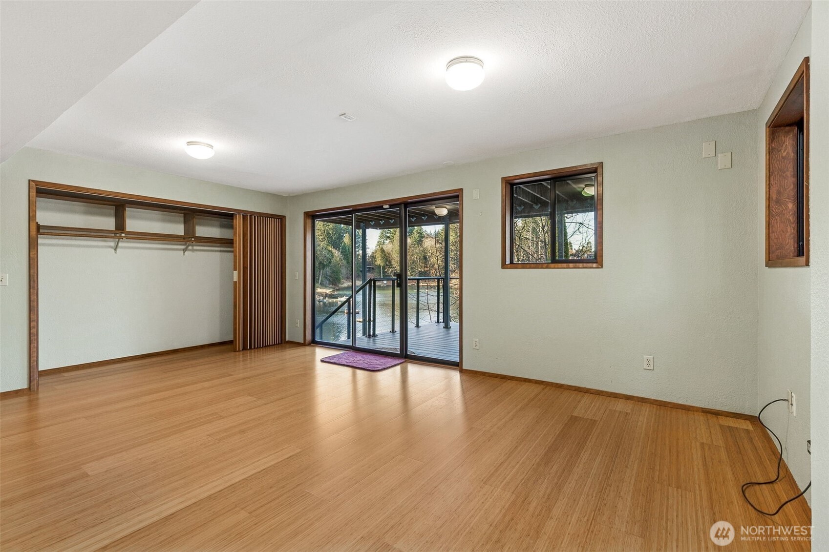 5221 Blvd Ext Road Southeast Olympia, WA 98501 - Photo 19 of 25 a view of an empty room with wooden floor and a window