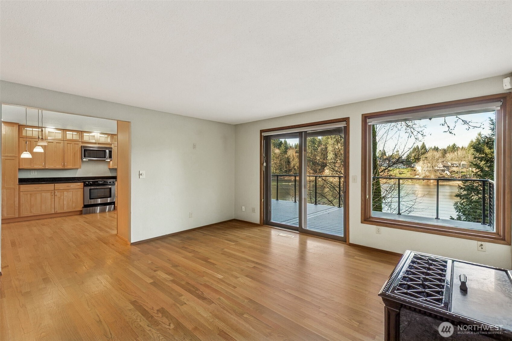 5221 Blvd Ext Road Southeast Olympia, WA 98501 - Photo 3 of 25 wooden floor in an empty room with a window