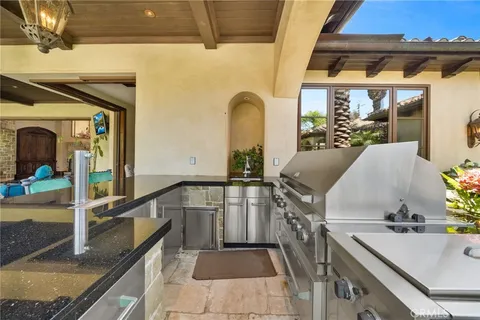 a kitchen with stainless steel appliances granite countertop a stove and a sink