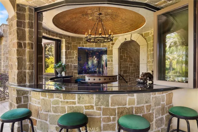 a dining room with furniture and chandelier