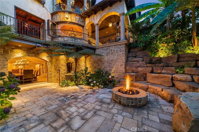 a view of a garden with sitting area