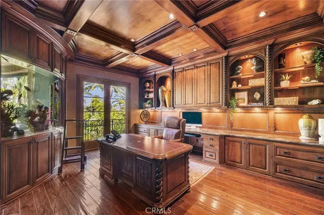 a bathroom with a granite countertop sink a toilet a mirror and shower