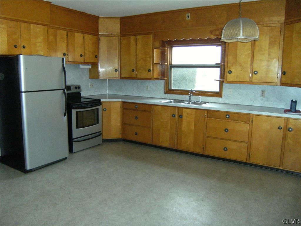 1115 Main Street Slatington, PA 18080 - Photo 12 of 19 a kitchen with sink cabinets and window