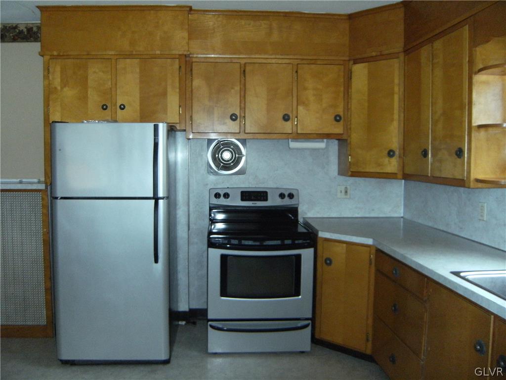 1115 Main Street Slatington, PA 18080 - Photo 13 of 19 a kitchen with cabinets and a stove top oven
